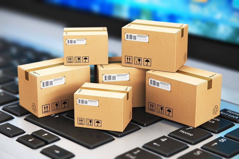Tiny boxes and parcels sitting on the laptop keys